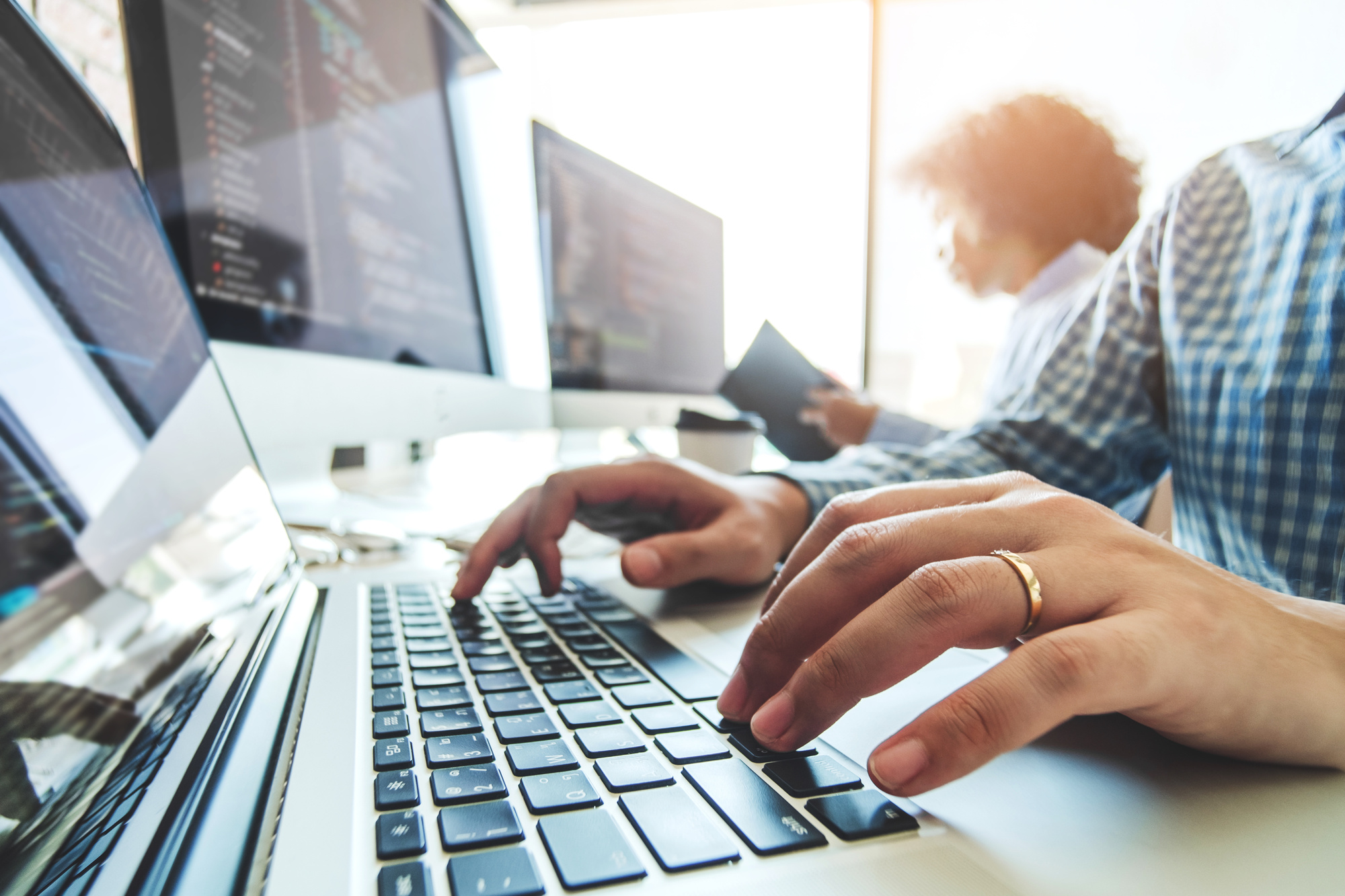 Developing programmer Team Development Website design and coding technologies working in software company office