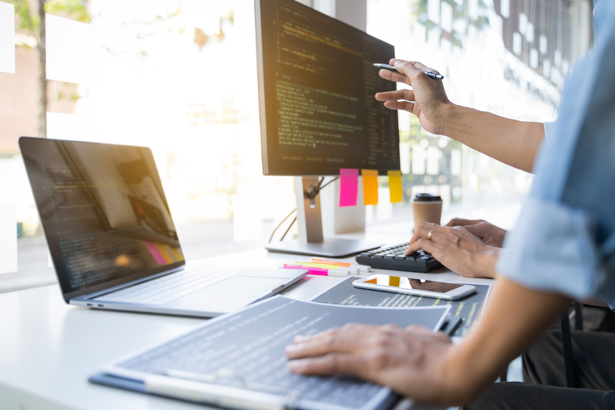Team of development programmer coding a software data.