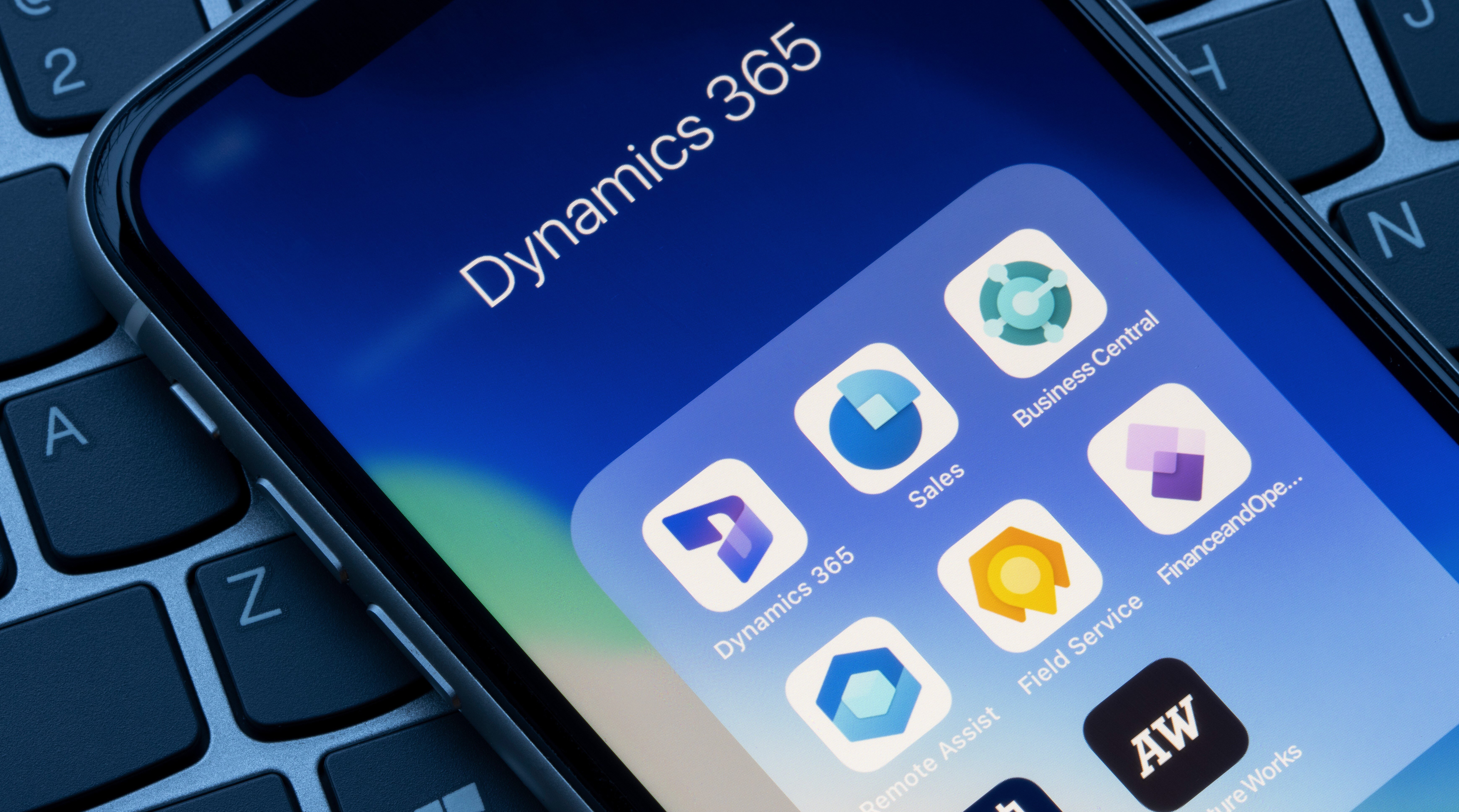 Microsoft Dynamics 365 app icons are seen on an iPhone.