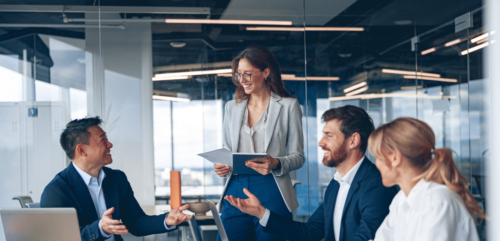 Office workers collaborating at a desk