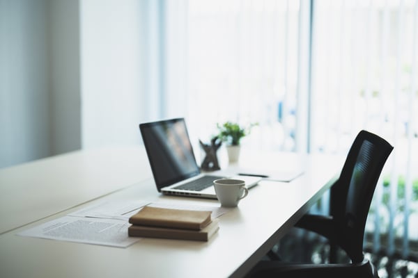 modern office interiors Workplace with laptop. business office background