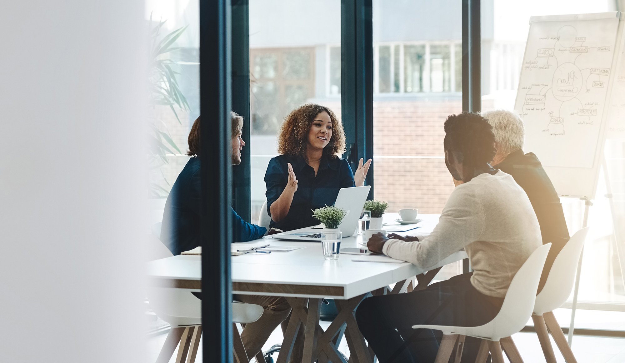 Planning, teamwork and meeting with business people in boardroom for strategy, brainstorming and solution. Corporate, collaboration and conference with employees in office for negotiation development