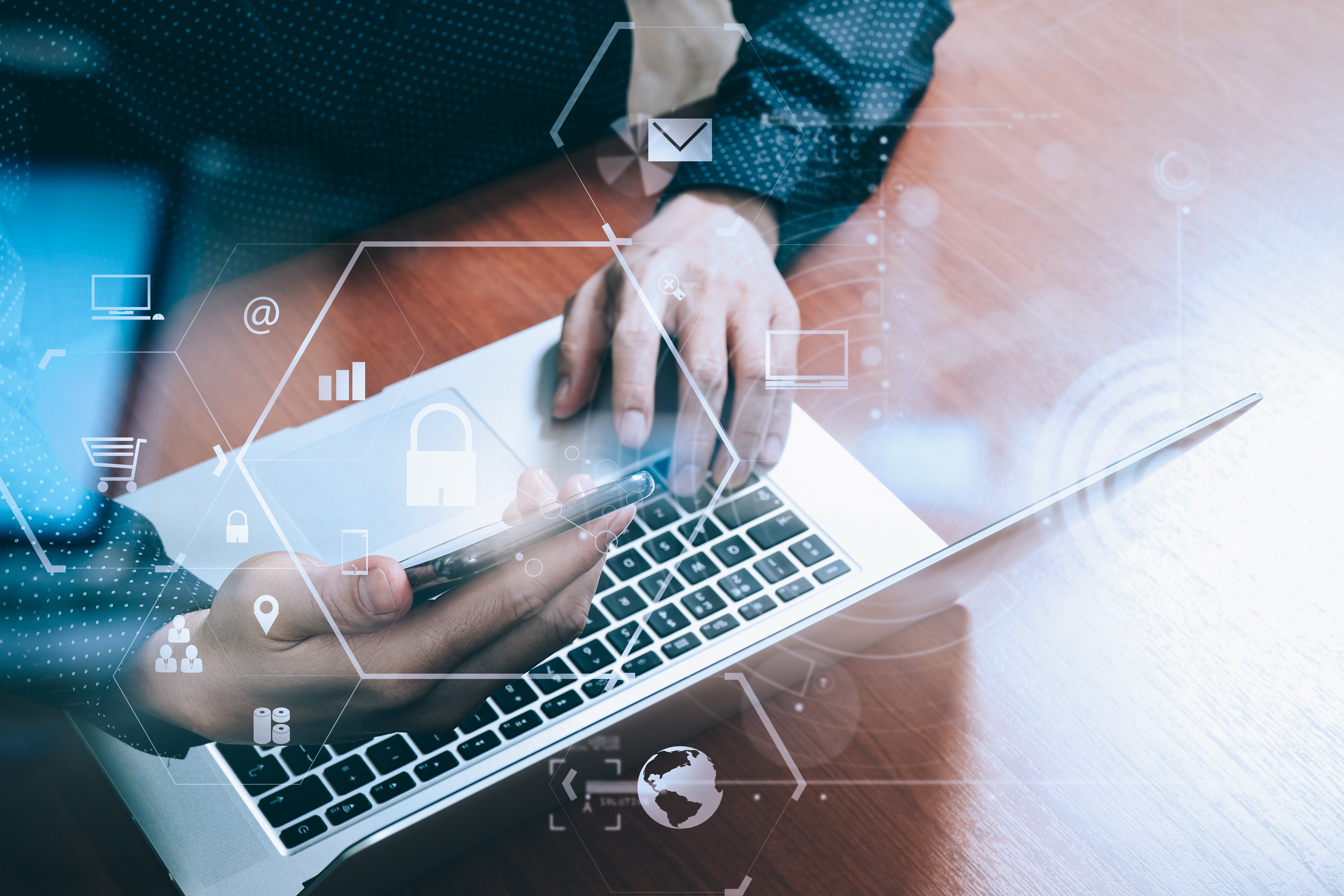 Business data and tools over a laptop.