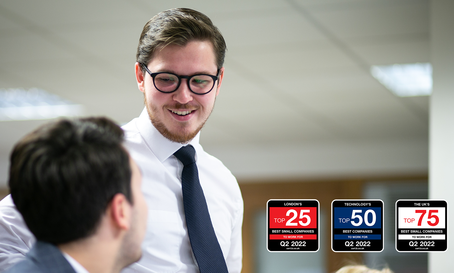 Fitzrovia employee smiling at coworker