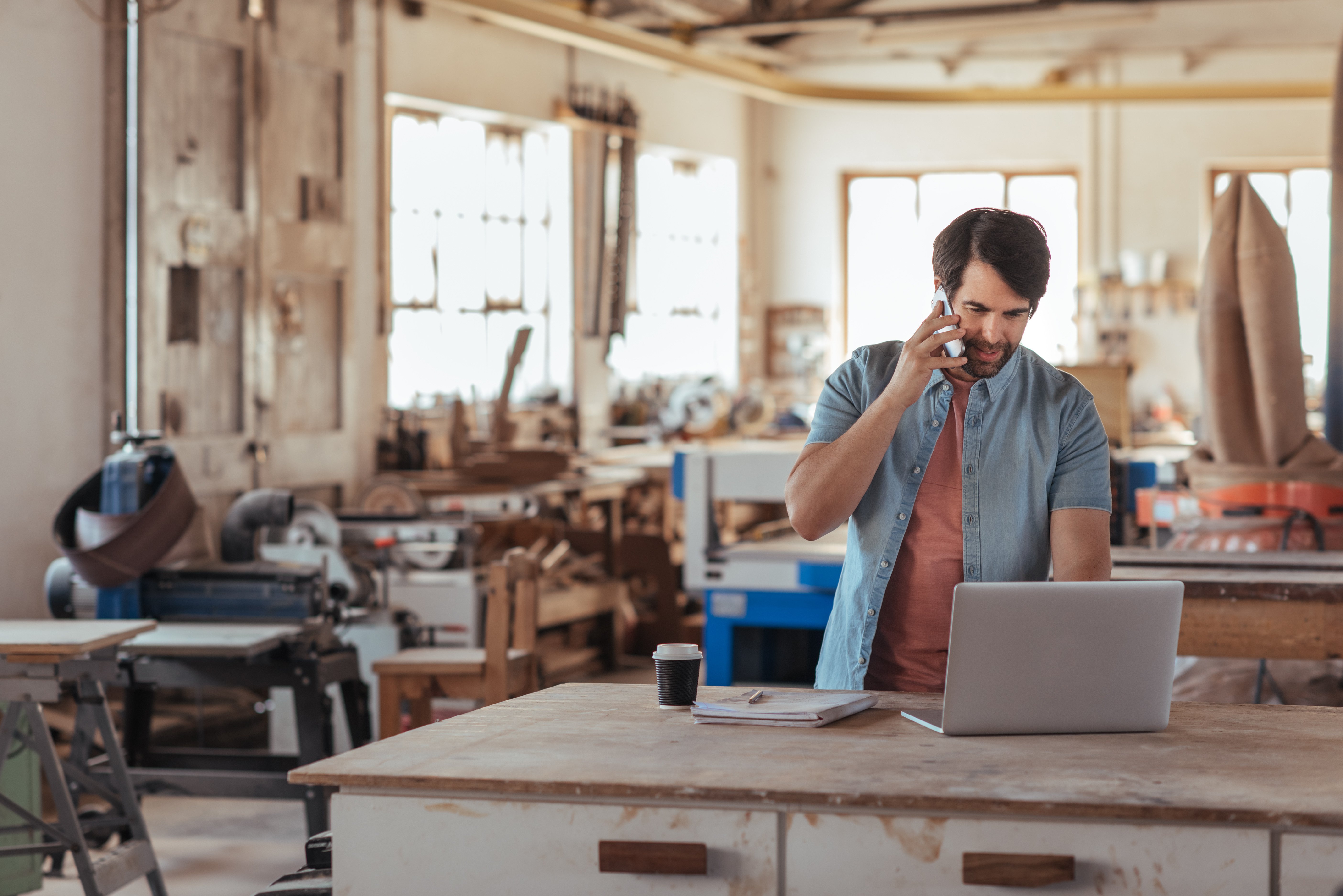 Man using both phone and laptop securely