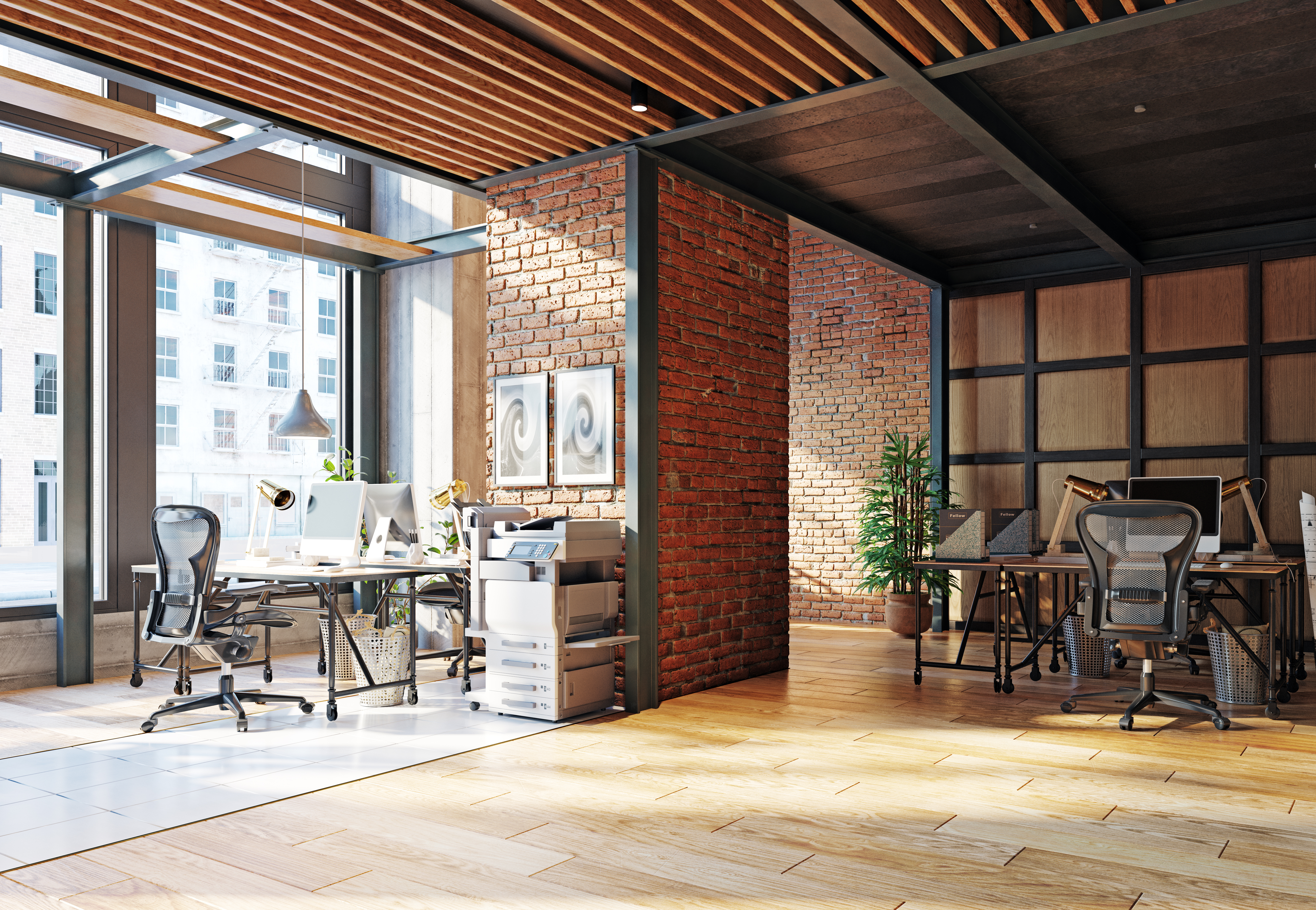 Featured image: A modern office with brick walls and wooden floors. - Read full post: Relocating office premises? Our top tips for a smooth tech move.