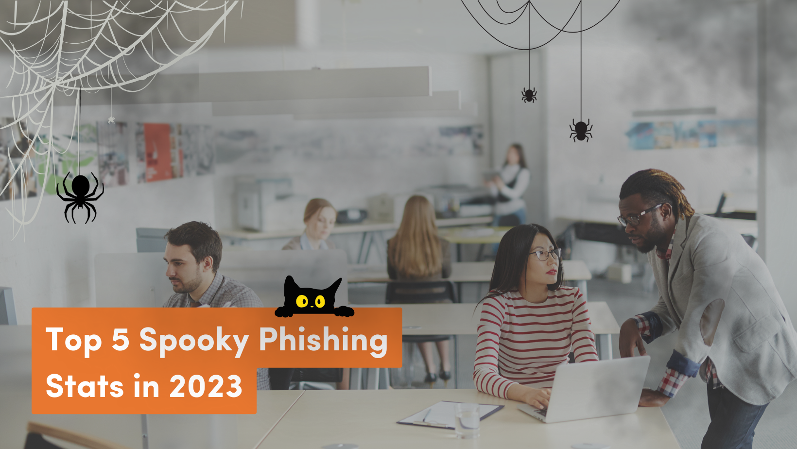 Featured image: People in office working amidst phishing threats - Read full post: Spooky Phishing Trends Haunting the Cyberworld This Halloween